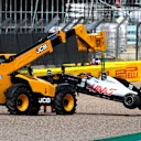NORTHAMPTON, ENGLAND - AUGUST 02: The car of Kevin Magnussen of Denmark and Haas F1 is taken away after spinning off during the F1 Grand Prix of Great Britain at Silverstone on August 02, 2020 in Northampton, England. (Photo by Rudy Carezzevoli/Getty Images)