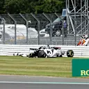 NORTHAMPTON, ENGLAND - AUGUST 02: Daniil Kvyat of Russia and Scuderia AlphaTauri looks at his car after crashing into a track barrier during the F1 Grand Prix of Great Britain at Silverstone on August 02, 2020 in Northampton, England. (Photo by Andrew Boyers/Pool via Getty Images)