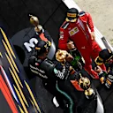 NORTHAMPTON, ENGLAND - AUGUST 02: Race winner Lewis Hamilton of Great Britain and Mercedes GP, second placed Max Verstappen of Netherlands and Red Bull Racing and third placed Charles Leclerc of Monaco and Ferrari celebrate on the podium during the F1 Grand Prix of Great Britain at Silverstone on August 02, 2020 in Northampton, England. (Photo by Clive Mason - Formula 1/Formula 1 via Getty Images)