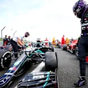 NORTHAMPTON, ENGLAND - AUGUST 02: Lewis Hamilton of Great Britain and Mercedes GP inspects his punctured tyre in parc ferme after the Formula One Grand Prix of Hungary at Silverstone on August 02, 2020 in Northampton, England. (Photo by Dan Istitene - Formula 1/Formula 1 via Getty Images)