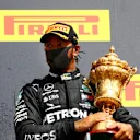 NORTHAMPTON, ENGLAND - AUGUST 02: Lewis Hamilton of Great Britain and Mercedes GP celebrates on the podium after winning the Formula One Grand Prix of Hungary at Silverstone on August 02, 2020 in Northampton, England. (Photo by Dan Istitene - Formula 1/Formula 1 via Getty Images)