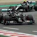 BUDAPEST, HUNGARY - JULY 18: Lewis Hamilton of Great Britain driving the (44) Mercedes AMG Petronas F1 Team Mercedes W11 leads teammate Valtteri Bottas of Finland driving the (77) Mercedes AMG Petronas F1 Team Mercedes W11 during qualifying for the F1 Grand Prix of Hungary at Hungaroring on July 18, 2020 in Budapest, Hungary. (Photo by Darko Bandic/Pool via Getty Images)