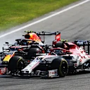 MONZA, ITALY - SEPTEMBER 06: Alexander Albon of Thailand driving the (23) Aston Martin Red Bull Racing RB16 and Antonio Giovinazzi of Italy driving the (99) Alfa Romeo Racing C39 Ferrari battle for position during the F1 Grand Prix of Italy at Autodromo di Monza on September 06, 2020 in Monza, Italy. (Photo by Mark Thompson/Getty Images)