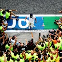 MONZA, ITALY - SEPTEMBER 06: Race winner Pierre Gasly of France and Scuderia AlphaTauri and teammate Daniil Kvyat of Russia and Scuderia AlphaTauri celebrate with team members during the F1 Grand Prix of Italy at Autodromo di Monza on September 06, 2020 in Monza, Italy. (Photo by Dan Istitene - Formula 1/Formula 1 via Getty Images)