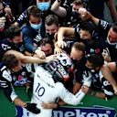 MONZA, ITALY - SEPTEMBER 06: Race winner Pierre Gasly of France and Scuderia AlphaTauri celebrates with team members in parc ferme during the F1 Grand Prix of Italy at Autodromo di Monza on September 06, 2020 in Monza, Italy. (Photo by Mark Thompson/Getty Images)