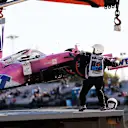 PORTIMAO, PORTUGAL - OCTOBER 23: The car of Lance Stroll of Canada and Racing Point is removed from the track after a crash during practice ahead of the F1 Grand Prix of Portugal at Autodromo Internacional do Algarve on October 23, 2020 in Portimao, Portugal. (Photo by Jorge Guerrero - Pool/Getty Images)