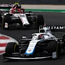 PORTIMAO, PORTUGAL - OCTOBER 25: George Russell of Great Britain driving the (63) Williams Racing FW43 Mercedes leads Antonio Giovinazzi of Italy driving the (99) Alfa Romeo Racing C39 Ferrari on track during the F1 Grand Prix of Portugal at Autodromo Internacional do Algarve on October 25, 2020 in Portimao, Portugal. (Photo by Rudy Carezzevoli/Getty Images)