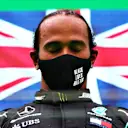 PORTIMAO, PORTUGAL - OCTOBER 25: Race winner Lewis Hamilton of Great Britain and Mercedes GP celebrates his record breaking 92nd race win on the podium during the F1 Grand Prix of Portugal at Autodromo Internacional do Algarve on October 25, 2020 in Portimao, Portugal. (Photo by Dan Istitene - Formula 1/Formula 1 via Getty Images)