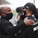 PORTIMAO, PORTUGAL - OCTOBER 25: Race winner Lewis Hamilton of Great Britain and Mercedes GP celebrates his record breaking 92nd race win with his father Anthony Hamilton in parc ferme during the F1 Grand Prix of Portugal at Autodromo Internacional do Algarve on October 25, 2020 in Portimao, Portugal. (Photo by Jorge Guerrero - Pool/Getty Images)