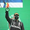 PORTIMAO, PORTUGAL - OCTOBER 25: Second placed Valtteri Bottas of Finland and Mercedes GP celebrates on the podium during the F1 Grand Prix of Portugal at Autodromo Internacional do Algarve on October 25, 2020 in Portimao, Portugal. (Photo by Bryn Lennon - Formula 1/Formula 1 via Getty Images)