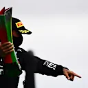 PORTIMAO, PORTUGAL - OCTOBER 25: Race winner Lewis Hamilton of Great Britain and Mercedes GP celebrates his record breaking 92nd race win on the podium during the F1 Grand Prix of Portugal at Autodromo Internacional do Algarve on October 25, 2020 in Portimao, Portugal. (Photo by Mario Renzi - Formula 1/Formula 1 via Getty Images)