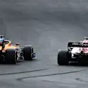 PORTIMAO, PORTUGAL - OCTOBER 25: Carlos Sainz of Spain driving the (55) McLaren F1 Team MCL35 Renault and Kimi Raikkonen of Finland driving the (7) Alfa Romeo Racing C39 Ferrari battle for track position during the F1 Grand Prix of Portugal at Autodromo Internacional do Algarve on October 25, 2020 in Portimao, Portugal. (Photo by Bryn Lennon - Formula 1/Formula 1 via Getty Images)