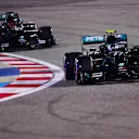 BAHRAIN, BAHRAIN - DECEMBER 05: Valtteri Bottas of Finland driving the (77) Mercedes AMG Petronas F1 Team Mercedes W11 leads George Russell of Great Britain driving the (63) Mercedes AMG Petronas F1 Team Mercedes W11 during qualifying ahead of the F1 Grand Prix of Sakhir at Bahrain International Circuit on December 05, 2020 in Bahrain, Bahrain. (Photo by Giuseppe Cacace - Pool/Getty Images)