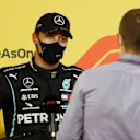 BAHRAIN, BAHRAIN - DECEMBER 05: Second placed qualifier George Russell of Great Britain and Mercedes GP speaks with Sky Sports F1 Presenter Paul di Resta in parc ferme during qualifying ahead of the F1 Grand Prix of Sakhir at Bahrain International Circuit on December 05, 2020 in Bahrain, Bahrain. (Photo by Hamad I Mohammed - Pool/Getty Images)