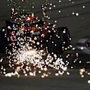BAHRAIN, BAHRAIN - DECEMBER 05: Sparks fly behind Alexander Albon of Thailand driving the (23) Aston Martin Red Bull Racing RB16 during qualifying ahead of the F1 Grand Prix of Sakhir at Bahrain International Circuit on December 05, 2020 in Bahrain, Bahrain. (Photo by Bryn Lennon/Getty Images)