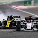 BAHRAIN, BAHRAIN - DECEMBER 06: Daniil Kvyat of Russia driving the (26) Scuderia AlphaTauri AT01 Honda and Daniel Ricciardo of Australia driving the (3) Renault Sport Formula One Team RS20 battle for position during the F1 Grand Prix of Sakhir at Bahrain International Circuit on December 06, 2020 in Bahrain, Bahrain. (Photo by Dan Istitene - Formula 1/Formula 1 via Getty Images)