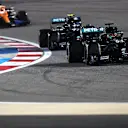 BAHRAIN, BAHRAIN - DECEMBER 06: George Russell of Great Britain driving the (63) Mercedes AMG Petronas F1 Team Mercedes W11 leads Valtteri Bottas of Finland driving the (77) Mercedes AMG Petronas F1 Team Mercedes W11 on track during the F1 Grand Prix of Sakhir at Bahrain International Circuit on December 06, 2020 in Bahrain, Bahrain. (Photo by Rudy Carezzevoli/Getty Images)