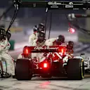 BAHRAIN, BAHRAIN - DECEMBER 06: Kimi Raikkonen of Finland driving the (7) Alfa Romeo Racing C39 Ferrari makes a pitstop during the F1 Grand Prix of Sakhir at Bahrain International Circuit on December 06, 2020 in Bahrain, Bahrain. (Photo by Peter Fox/Getty Images)