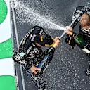 BARCELONA, SPAIN - AUGUST 16: Race winner Lewis Hamilton of Great Britain and Mercedes GP and third placed Valtteri Bottas of Finland and Mercedes GP celebrate on the podium during the F1 Grand Prix of Spain at Circuit de Barcelona-Catalunya on August 16, 2020 in Barcelona, Spain. (Photo by Clive Mason - Formula 1/Formula 1 via Getty Images)
