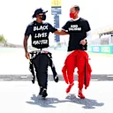 BARCELONA, SPAIN - AUGUST 16: Lewis Hamilton of Great Britain and Mercedes GP and Sebastian Vettel of Germany and Ferrari talk on the grid before the F1 Grand Prix of Spain at Circuit de Barcelona-Catalunya on August 16, 2020 in Barcelona, Spain. (Photo by Dan Istitene - Formula 1/Formula 1 via Getty Images)