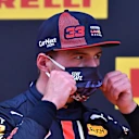 SPIELBERG, AUSTRIA - JULY 11: Second placed qualifier Max Verstappen of Netherlands and Red Bull Racing puts on his mask in parc ferme during qualifying for the Formula One Grand Prix of Styria at Red Bull Ring on July 11, 2020 in Spielberg, Austria. (Photo by Joe Klamar/Pool via Getty Images)