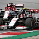 SPIELBERG, AUSTRIA - JULY 12: Kevin Magnussen of Denmark driving the (20) Haas F1 Team VF-20 Ferrari battles for position with Kimi Raikkonen of Finland driving the (7) Alfa Romeo Racing C39 Ferrari during the Formula One Grand Prix of Styria at Red Bull Ring on July 12, 2020 in Spielberg, Austria. (Photo by Bryn Lennon/Getty Images)