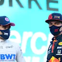 ISTANBUL, TURKEY - NOVEMBER 14: Pole position qualifier Lance Stroll of Canada and Racing Point speaks with second placed qualifier Max Verstappen of Netherlands and Red Bull Racing in parc ferme during qualifying ahead of the F1 Grand Prix of Turkey at Intercity Istanbul Park on November 14, 2020 in Istanbul, Turkey. (Photo by Clive Mason/Getty Images)