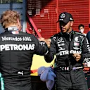 SCARPERIA, ITALY - SEPTEMBER 12: Pole position qualifier Lewis Hamilton of Great Britain and Mercedes GP celebrates with second placed qualifier Valtteri Bottas of Finland and Mercedes GP during qualifying for the F1 Grand Prix of Tuscany at Mugello Circuit on September 12, 2020 in Scarperia, Italy. (Photo by Luca Bruno - Pool/Getty Images)