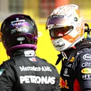 SCARPERIA, ITALY - SEPTEMBER 12: Pole position qualifier Lewis Hamilton of Great Britain and Mercedes GP and third placed qualifier Max Verstappen of Netherlands and Red Bull Racing talk in parc ferme during qualifying for the F1 Grand Prix of Tuscany at Mugello Circuit on September 12, 2020 in Scarperia, Italy. (Photo by Bryn Lennon/Getty Images)