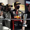 SCARPERIA, ITALY - SEPTEMBER 13: Race winner Lewis Hamilton of Great Britain and Mercedes GP, second placed Valtteri Bottas of Finland and Mercedes GP and third placed Alexander Albon of Thailand and Red Bull Racing celebrate on the podium during the F1 Grand Prix of Tuscany at Mugello Circuit on September 13, 2020 in Scarperia, Italy. (Photo by Luca Bruno - Pool/Getty Images)
