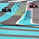 ABU DHABI, UNITED ARAB EMIRATES - DECEMBER 10: Lance Stroll of Canada driving the (18) Aston Martin AMR21 Mercedes and Charles Leclerc of Monaco driving the (16) Scuderia Ferrari SF21  during practice ahead of the F1 Grand Prix of Abu Dhabi at Yas Marina Circuit on December 10, 2021 in Abu Dhabi, United Arab Emirates. (Photo by Mark Thompson/Getty Images)