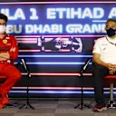 ABU DHABI, UNITED ARAB EMIRATES - DECEMBER 10: Scuderia Ferrari Team Principal Mattia Binotto and Masashi Yamamoto of Honda talk in the team principals press conference ahead of the F1 Grand Prix of Abu Dhabi at Yas Marina Circuit on December 10, 2021 in Abu Dhabi, United Arab Emirates. (Photo by Bryn Lennon/Getty Images)