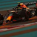 ABU DHABI, UNITED ARAB EMIRATES - DECEMBER 11: Sergio Perez of Mexico driving the (11) Red Bull Racing RB16B Honda during qualifying ahead of the F1 Grand Prix of Abu Dhabi at Yas Marina Circuit on December 11, 2021 in Abu Dhabi, United Arab Emirates. (Photo by Clive Rose/Getty Images)
