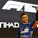 ABU DHABI, UNITED ARAB EMIRATES - DECEMBER 11: Third place qualifier Lando Norris of Great Britain and McLaren F1 celebrates in parc ferme during qualifying ahead of the F1 Grand Prix of Abu Dhabi at Yas Marina Circuit on December 11, 2021 in Abu Dhabi, United Arab Emirates. (Photo by Mark Thompson/Getty Images)