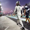 ABU DHABI, UNITED ARAB EMIRATES - DECEMBER 11: Pierre Gasly of France and Scuderia AlphaTauri walks in the Pitlane during qualifying ahead of the F1 Grand Prix of Abu Dhabi at Yas Marina Circuit on December 11, 2021 in Abu Dhabi, United Arab Emirates. (Photo by Mark Thompson/Getty Images)