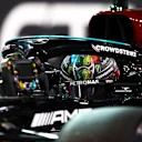 ABU DHABI, UNITED ARAB EMIRATES - DECEMBER 11: Second placed qualifier Lewis Hamilton of Great Britain and Mercedes GP stops in parc ferme during qualifying ahead of the F1 Grand Prix of Abu Dhabi at Yas Marina Circuit on December 11, 2021 in Abu Dhabi, United Arab Emirates. (Photo by Dan Istitene - Formula 1/Formula 1 via Getty Images)