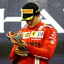 ABU DHABI, UNITED ARAB EMIRATES - DECEMBER 12: Third placed Carlos Sainz of Spain and Ferrari celebrates on the podium during the F1 Grand Prix of Abu Dhabi at Yas Marina Circuit on December 12, 2021 in Abu Dhabi, United Arab Emirates. (Photo by Bryn Lennon/Getty Images)