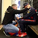 ABU DHABI, UNITED ARAB EMIRATES - DECEMBER 12: Race winner and 2021 F1 World Drivers Champion Max Verstappen of Netherlands and Red Bull Racing celebrates with his father Jos Verstappen in parc ferme during the F1 Grand Prix of Abu Dhabi at Yas Marina Circuit on December 12, 2021 in Abu Dhabi, United Arab Emirates. (Photo by Mark Thompson/Getty Images)