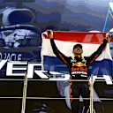ABU DHABI, UNITED ARAB EMIRATES - DECEMBER 12: Race winner and 2021 F1 World Drivers Champion Max Verstappen of Netherlands and Red Bull Racing celebrates on the podium during the F1 Grand Prix of Abu Dhabi at Yas Marina Circuit on December 12, 2021 in Abu Dhabi, United Arab Emirates. (Photo by Mark Thompson/Getty Images)