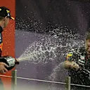 ABU DHABI, UNITED ARAB EMIRATES - DECEMBER 12: Race winner and 2021 F1 World Drivers Champion Max Verstappen of Netherlands and Red Bull Racing celebrates with Red Bull Racing Team Principal Christian Horner on the podium during the F1 Grand Prix of Abu Dhabi at Yas Marina Circuit on December 12, 2021 in Abu Dhabi, United Arab Emirates. (Photo by Joe Portlock - Formula 1/Formula 1 via Getty Images)
