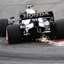 SPIELBERG, AUSTRIA - JULY 02: Sparks fly behind Pierre Gasly of France driving the (10) Scuderia AlphaTauri AT02 Honda during practice ahead of the F1 Grand Prix of Austria at Red Bull Ring on July 02, 2021 in Spielberg, Austria. (Photo by Clive Rose/Getty Images)