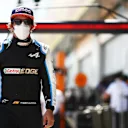 SPIELBERG, AUSTRIA - JULY 03: Fernando Alonso of Spain and Alpine F1 Team walks in the Pitlane during qualifying ahead of the F1 Grand Prix of Austria at Red Bull Ring on July 03, 2021 in Spielberg, Austria. (Photo by Mark Thompson/Getty Images)