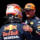 SPIELBERG, AUSTRIA - JULY 03: Pole position qualifier Max Verstappen of Netherlands and Red Bull Racing and third place qualifier Sergio Perez of Mexico and Red Bull Racing celebrate in parc ferme during qualifying ahead of the F1 Grand Prix of Austria at Red Bull Ring on July 03, 2021 in Spielberg, Austria. (Photo by Christian Bruna - Pool/Getty Images)