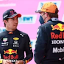 SPIELBERG, AUSTRIA - JULY 03: Pole position qualifier Max Verstappen of Netherlands and Red Bull Racing and third place qualifier Sergio Perez of Mexico and Red Bull Racing celebrate in parc ferme during qualifying ahead of the F1 Grand Prix of Austria at Red Bull Ring on July 03, 2021 in Spielberg, Austria. (Photo by Mark Thompson/Getty Images)
