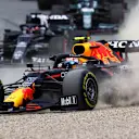 SPIELBERG, AUSTRIA - JULY 04: Sergio Perez of Mexico driving the (11) Red Bull Racing RB16B Honda runs wide during the F1 Grand Prix of Austria at Red Bull Ring on July 04, 2021 in Spielberg, Austria. (Photo by Clive Mason - Formula 1/Formula 1 via Getty Images)