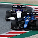 SPIELBERG, AUSTRIA - JULY 04: Fernando Alonso of Spain driving the (14) Alpine A521 Renault leads George Russell of Great Britain driving the (63) Williams Racing FW43B Mercedes during the F1 Grand Prix of Austria at Red Bull Ring on July 04, 2021 in Spielberg, Austria. (Photo by Clive Mason - Formula 1/Formula 1 via Getty Images)