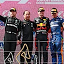 SPIELBERG, AUSTRIA - JULY 04: Race winner Max Verstappen of Netherlands and Red Bull Racing, second placed Valtteri Bottas of Finland and Mercedes GP, third placed Lando Norris of Great Britain and McLaren F1 and Toyoharu Tanabe of Honda celebrate on the podium during the F1 Grand Prix of Austria at Red Bull Ring on July 04, 2021 in Spielberg, Austria. (Photo by Mark Thompson/Getty Images)