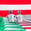 SPIELBERG, AUSTRIA - JULY 01: Pierre Gasly of Scuderia AlphaTauri and France with Yuki Tsunoda of Scuderia AlphaTauri and Japan  during previews ahead of the F1 Grand Prix of Austria at Red Bull Ring on July 01, 2021 in Spielberg, Austria. (Photo by Peter Fox/Getty Images)