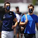 BAKU, AZERBAIJAN - JUNE 05: George Russell of Great Britain and Williams and Pierre Gasly of France and Scuderia AlphaTauri walk in the Paddock before final practice ahead of the F1 Grand Prix of Azerbaijan at Baku City Circuit on June 05, 2021 in Baku, Azerbaijan. (Photo by Mark Thompson/Getty Images)