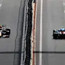 BAKU, AZERBAIJAN - JUNE 06: Sergio Perez of Mexico driving the (11) Red Bull Racing RB16B Honda and Esteban Ocon of France driving the (31) Alpine A521 Renault on their way to the grid before the F1 Grand Prix of Azerbaijan at Baku City Circuit on June 06, 2021 in Baku, Azerbaijan. (Photo by Clive Rose/Getty Images)